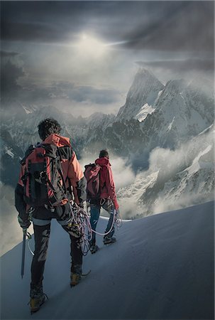 Two climbers on a snowy slope watching the Grand Jorasses, in the Mont Blanc Massif, Chamonix, France Photographie de stock - Premium Libres de Droits, Code: 649-08661164