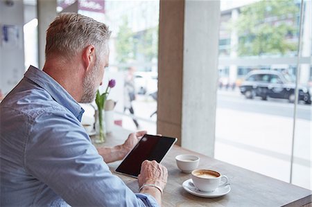 people outside cafe - Mature man sitting in cafe, using digital tablet, rear view Stock Photo - Premium Royalty-Free, Code: 649-08661332