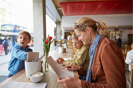simsearch:695-05771557,k - Mother and son at cafe looking at menu Stock Photo - Premium Royalty-Free, Code: 649-08661405