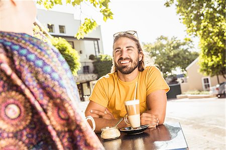 simsearch:649-08825304,k - Over shoulder view of young couple at sidewalk cafe, Franschhoek, South Africa Stock Photo - Premium Royalty-Free, Code: 649-08661565