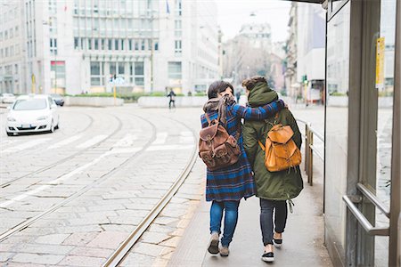 Two sisters walking along street, rear view Stock Photo - Premium Royalty-Free, Code: 649-08661794