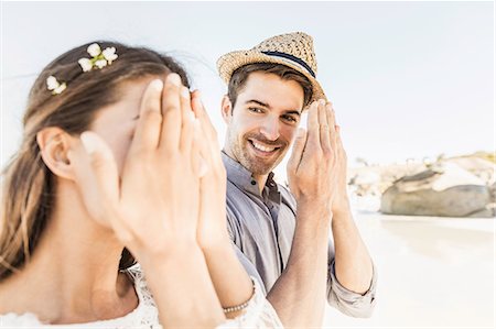 simsearch:649-08661944,k - Man peeking at girlfriend hiding face on beach, Cape Town, South Africa Stock Photo - Premium Royalty-Free, Code: 649-08661947