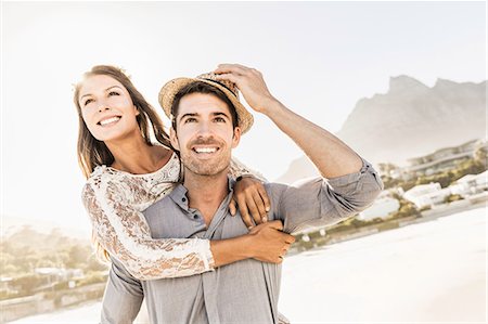 simsearch:649-08661944,k - Man giving girlfriend a piggy back on beach, Cape Town, South Africa Stock Photo - Premium Royalty-Free, Code: 649-08661952