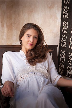 simsearch:649-08902086,k - Portrait of woman wearing kaftan sitting in chair, Marrakesh, Morocco Stock Photo - Premium Royalty-Free, Code: 649-08662256