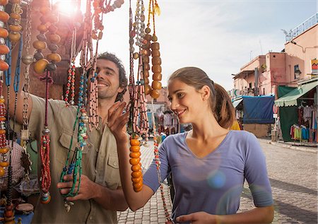 Young couple at market looking at beads, Jemaa el-Fnaa Square, Marrakesh, Morocco Stock Photo - Premium Royalty-Free, Code: 649-08662283