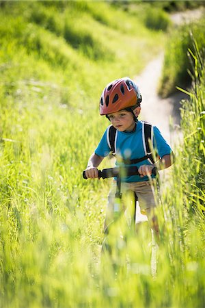 simsearch:649-08702087,k - Boy cycling in park Stock Photo - Premium Royalty-Free, Code: 649-08702085