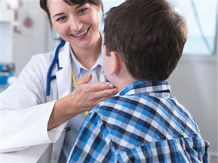 simsearch:400-08935984,k - Doctor checking for swollen glands on boy's neck Stock Photo - Premium Royalty-Free, Code: 649-08702106