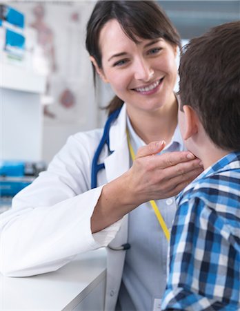 simsearch:400-08935984,k - Doctor checking for swollen glands on boy's neck Stock Photo - Premium Royalty-Free, Code: 649-08702107