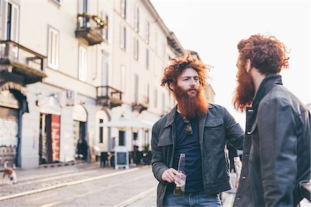 simsearch:649-08702682,k - Young male hipster twins with red hair and beards talking on city street Stock Photo - Premium Royalty-Free, Code: 649-08702660