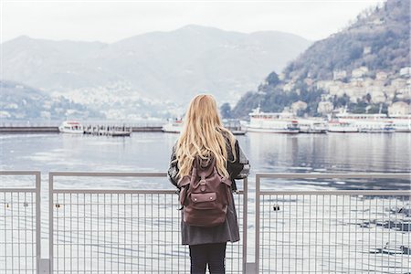 simsearch:649-08702807,k - Rear view of young woman looking out at Lake Como, Italy Photographie de stock - Premium Libres de Droits, Code: 649-08702790