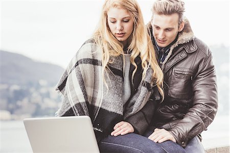 simsearch:649-08702811,k - Young couple using laptop, Lake Como, Italy Fotografie stock - Premium Royalty-Free, Codice: 649-08702815