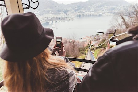 simsearch:649-08702811,k - Over the shoulder view of couple on funicular photographing Lake Como, Italy Stock Photo - Premium Royalty-Free, Code: 649-08702818