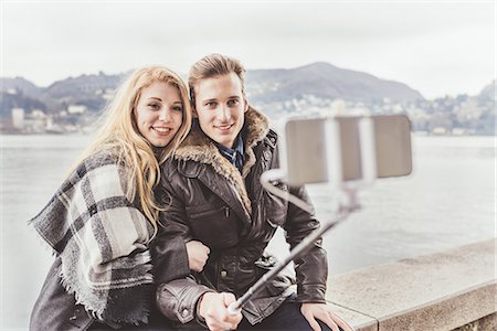 simsearch:649-08702811,k - Young couple taking smartphone selfie on harbour wall, Lake Como, Italy Stock Photo - Premium Royalty-Free, Code: 649-08702811