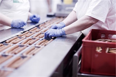 Factory workers on tofu sausage production line Stock Photo - Premium Royalty-Free, Code: 649-08703173