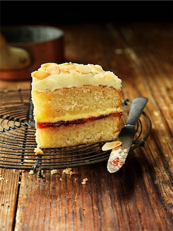 simsearch:649-08549046,k - Sherry trifle cake slice with knife, vintage wooden table Stock Photo - Premium Royalty-Free, Code: 649-08703514