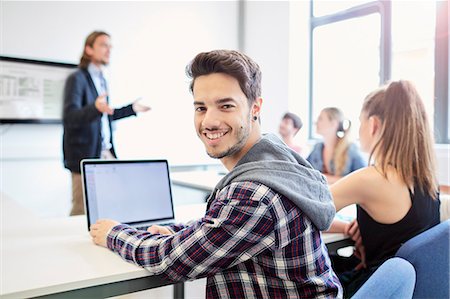 simsearch:649-07648135,k - Portrait of young male student using laptop in higher education college classroom Stock Photo - Premium Royalty-Free, Code: 649-08714102