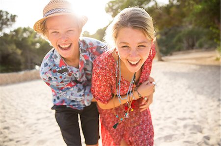 Couple on beach fooling around, looking at camera, Majorca, Spain Stock Photo - Premium Royalty-Free, Code: 649-08714876