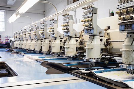 stitch (non medical thread) - Rows of programmed embroidery machines speed stitching in clothing factory Stock Photo - Premium Royalty-Free, Code: 649-08714900