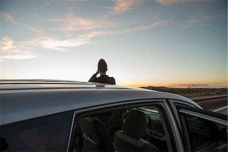 road and cars - Rear view of silhouetted woman watching sunset, Mojave Desert, California, USA Stock Photo - Premium Royalty-Free, Code: 649-08714963