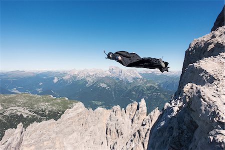 simsearch:649-08714984,k - Wingsuit BASE jumper jumping from cliff, Italian Alps, Alleghe, Belluno, Italy Stock Photo - Premium Royalty-Free, Code: 649-08715000