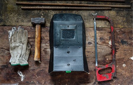 Gloves, hammer, welding visor, saw Stock Photo - Premium Royalty-Free, Code: 649-08744882