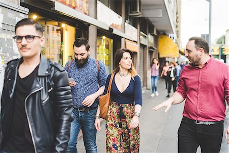 smiling glasses female - Group of friends walking on sidewalk Stock Photo - Premium Royalty-Free, Code: 649-08744990