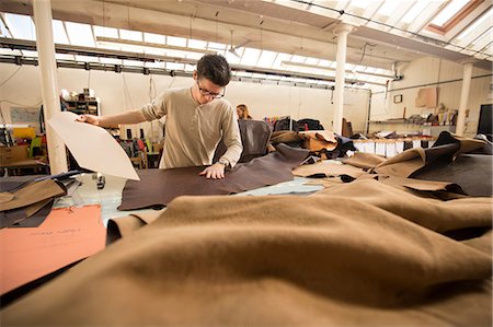 precision work - Man working in leather jacket manufacturers Stock Photo - Premium Royalty-Free, Code: 649-08745198