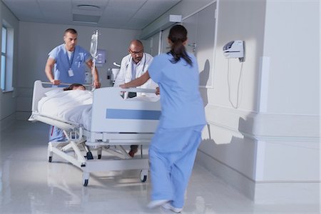 Doctor and medical running with patient bed in hospital emergency Stockbilder - Premium RF Lizenzfrei, Bildnummer: 649-08745376