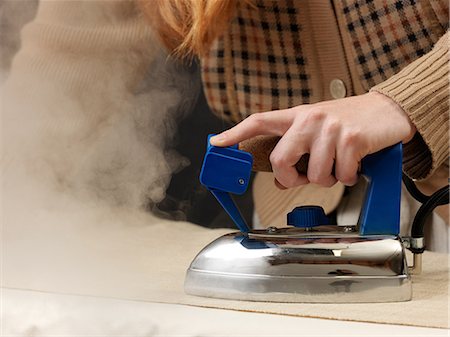 steaming hot women - Cropped shot of young female designer steam ironing fabric Stock Photo - Premium Royalty-Free, Code: 649-08745563