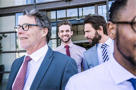 simsearch:649-07520113,k - Businessmen talking whilst leaving office building Stock Photo - Premium Royalty-Free, Code: 649-08765799