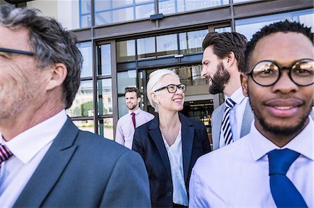 simsearch:649-07520113,k - Businesswoman and men leaving office building Stock Photo - Premium Royalty-Free, Code: 649-08765801