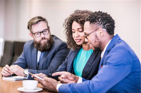 simsearch:649-08745597,k - Businesswoman and businessmen using digital tablet in board meeting Stock Photo - Premium Royalty-Free, Code: 649-08765822