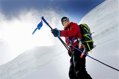 simsearch:649-08765879,k - Mountaineers holding walking poles looking away smiling, Saas Fee, Switzerland Stockbilder - Premium RF Lizenzfrei, Bildnummer: 649-08765830