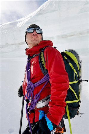 simsearch:649-08765875,k - Portrait of man with mountaineering equipment looking away Foto de stock - Royalty Free Premium, Número: 649-08765831