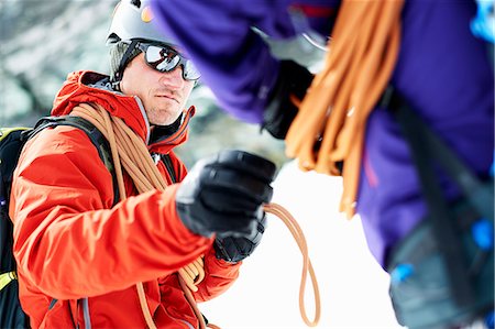 simsearch:649-08765875,k - Mountaineers preparing climbing equipment Foto de stock - Royalty Free Premium, Número: 649-08765859