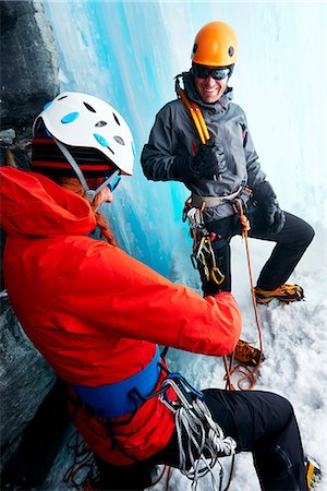 simsearch:649-08765875,k - Ice climbers in ice cave preparing climbing equipment Foto de stock - Royalty Free Premium, Número: 649-08765876