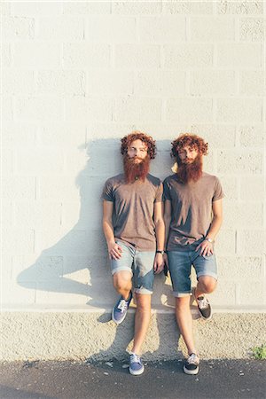 simsearch:649-08702682,k - Portrait of identical adult male twins with red hair and beards against white wall Stock Photo - Premium Royalty-Free, Code: 649-08765965