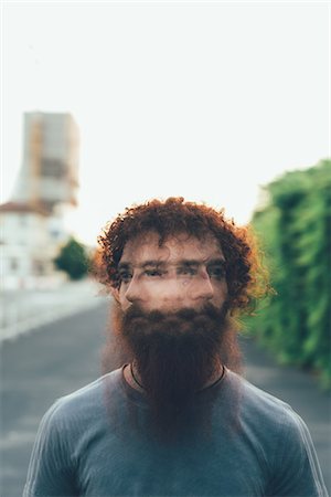 Multiple exposure portrait of young male hipster shaking head Stock Photo - Premium Royalty-Free, Code: 649-08765969