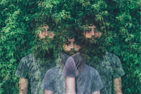 surrealism - Triple exposure portrait of transparent young man and green foliage Stock Photo - Premium Royalty-Free, Code: 649-08765970