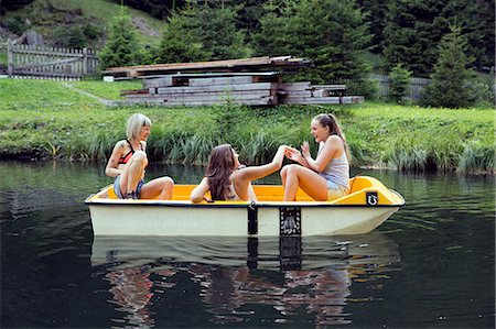 simsearch:649-08824522,k - Three adult female friends having fun in rowing boat on lake, Sattelbergalm, Tirol, Austria Stock Photo - Premium Royalty-Free, Code: 649-08766008