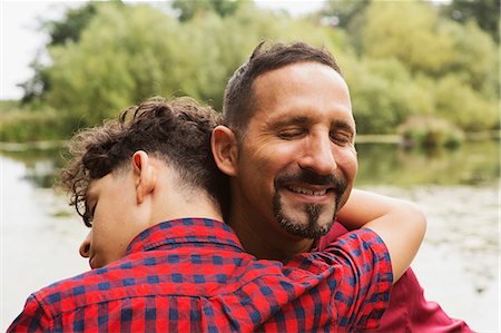 simsearch:693-06013621,k - Portrait of father and son, outdoors, hugging Stock Photo - Premium Royalty-Free, Code: 649-08766189