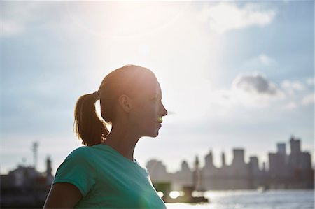 Woman by water looking away, Manhattan, New York, USA Stock Photo - Premium Royalty-Free, Code: 649-08824100