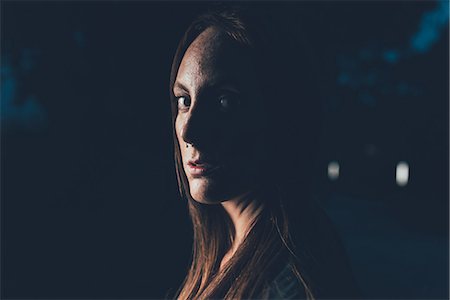 simsearch:649-08824678,k - Portrait of young freckled woman with nose piercing at night Stockbilder - Premium RF Lizenzfrei, Bildnummer: 649-08824669