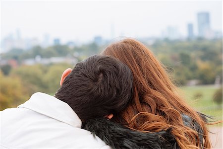 simsearch:649-08306717,k - Rear view of couple head to head hugging Photographie de stock - Premium Libres de Droits, Code: 649-08825060