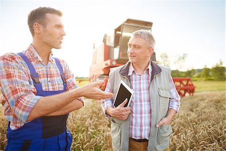 food production - Farmers in wheat field having discussion Stock Photo - Premium Royalty-Free, Code: 649-08825148