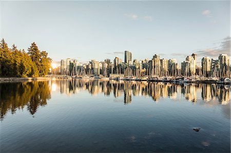 View of city skyline and marina at sunset, Vancouver, Canada Stock Photo - Premium Royalty-Free, Code: 649-08825228