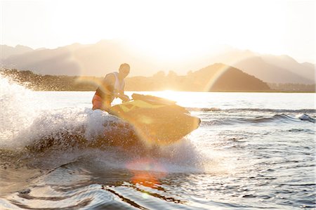 Man riding jet ski on lake, Beijing, China Stock Photo - Premium Royalty-Free, Code: 649-08825263