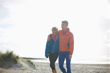 simsearch:649-09111242,k - Couple walking together on beach Stock Photo - Premium Royalty-Free, Code: 649-08825296