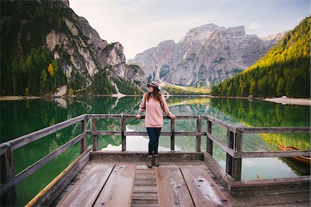 simsearch:649-08901663,k - Woman leaning against wooden railing, Lago di Braies, Dolomite Alps, Val di Braies, South Tyrol, Italy Stock Photo - Premium Royalty-Free, Code: 649-08840076