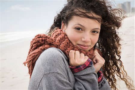 Portrait of young woman wrapped in scarf on windy beach, Western Cape, South Africa Stock Photo - Premium Royalty-Free, Code: 649-08840210
